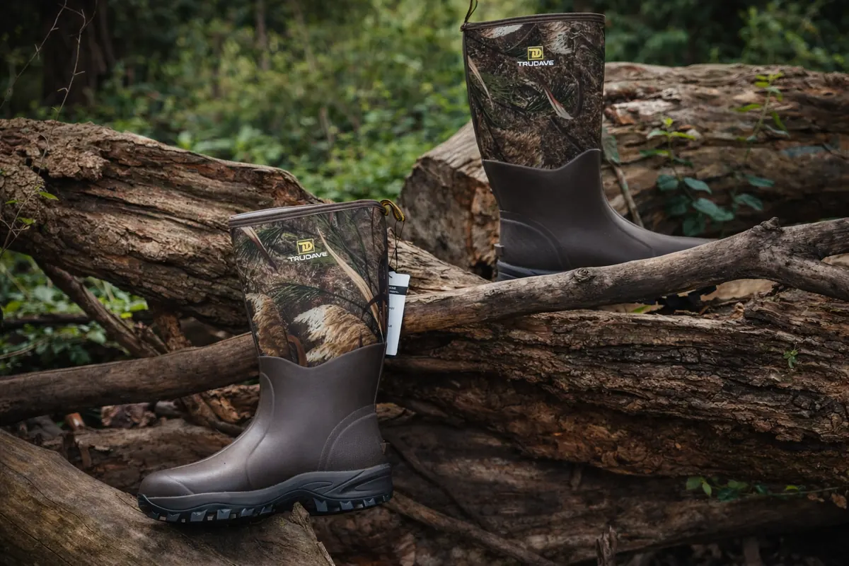 Two camouflage boots on fallen logs, professionally photographed for KyCreekers.